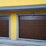 installazione due porte sezionali da garage finto legno